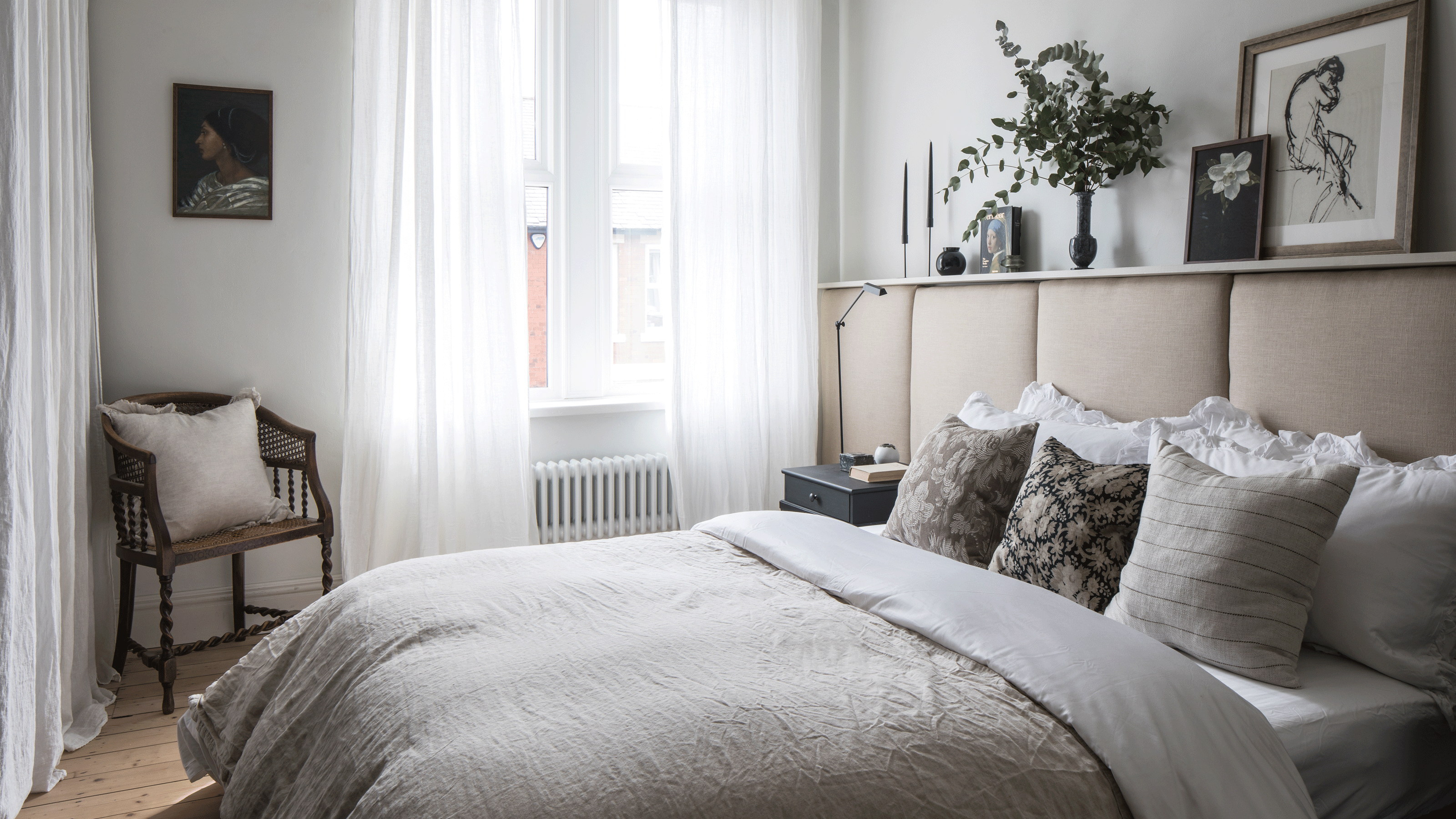 Grey bedroom with padded headboard