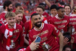 Liverpool players celebrate winning the 2024/25 Premier League title.