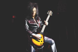 Steve Stevens, pictured playing his signature Knaggs SSC-J guitar