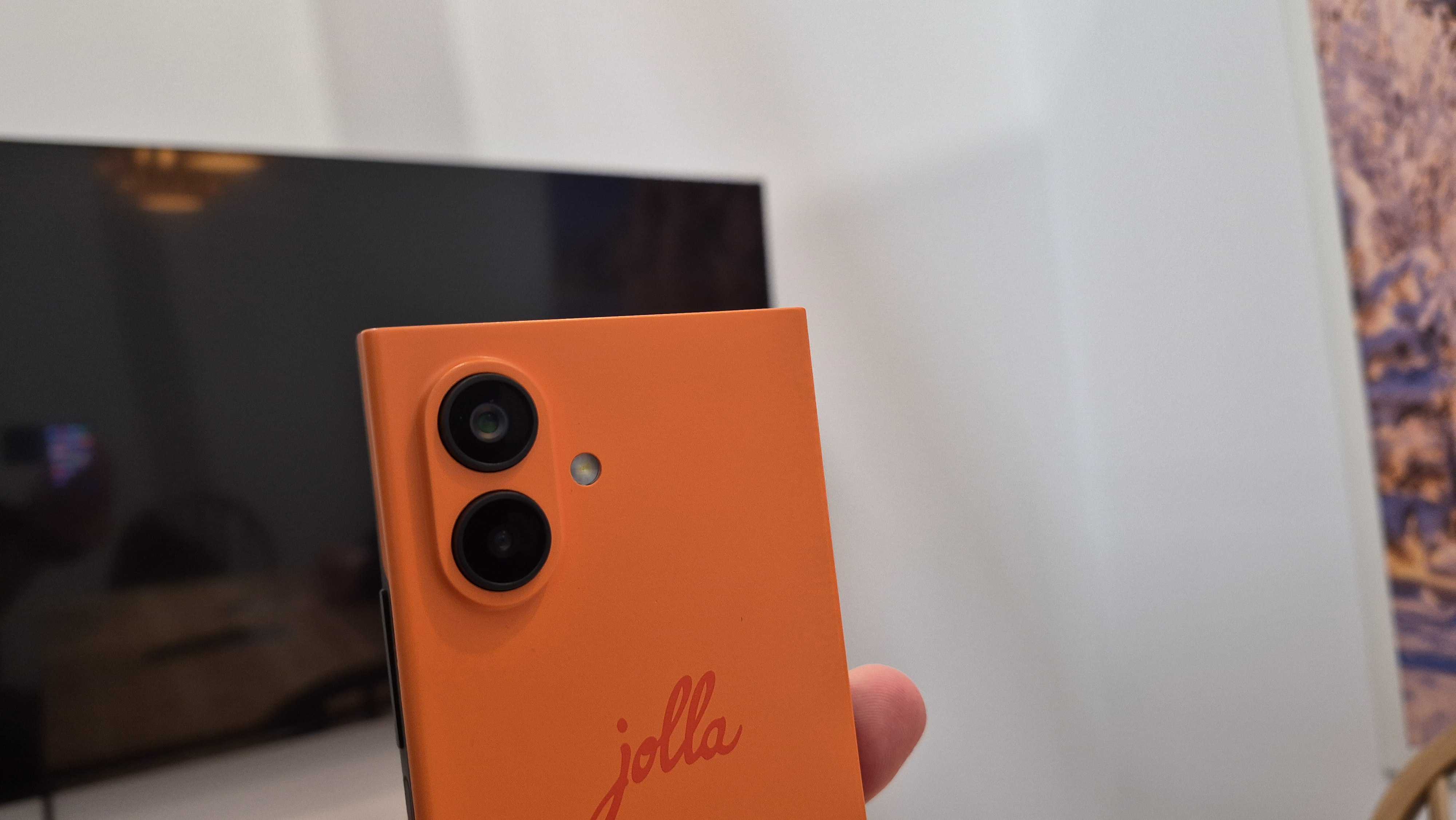 Images of the Jolla Phone including camera lenses and screen display, pictured at MWC 2026 in Barcelona, Spain.