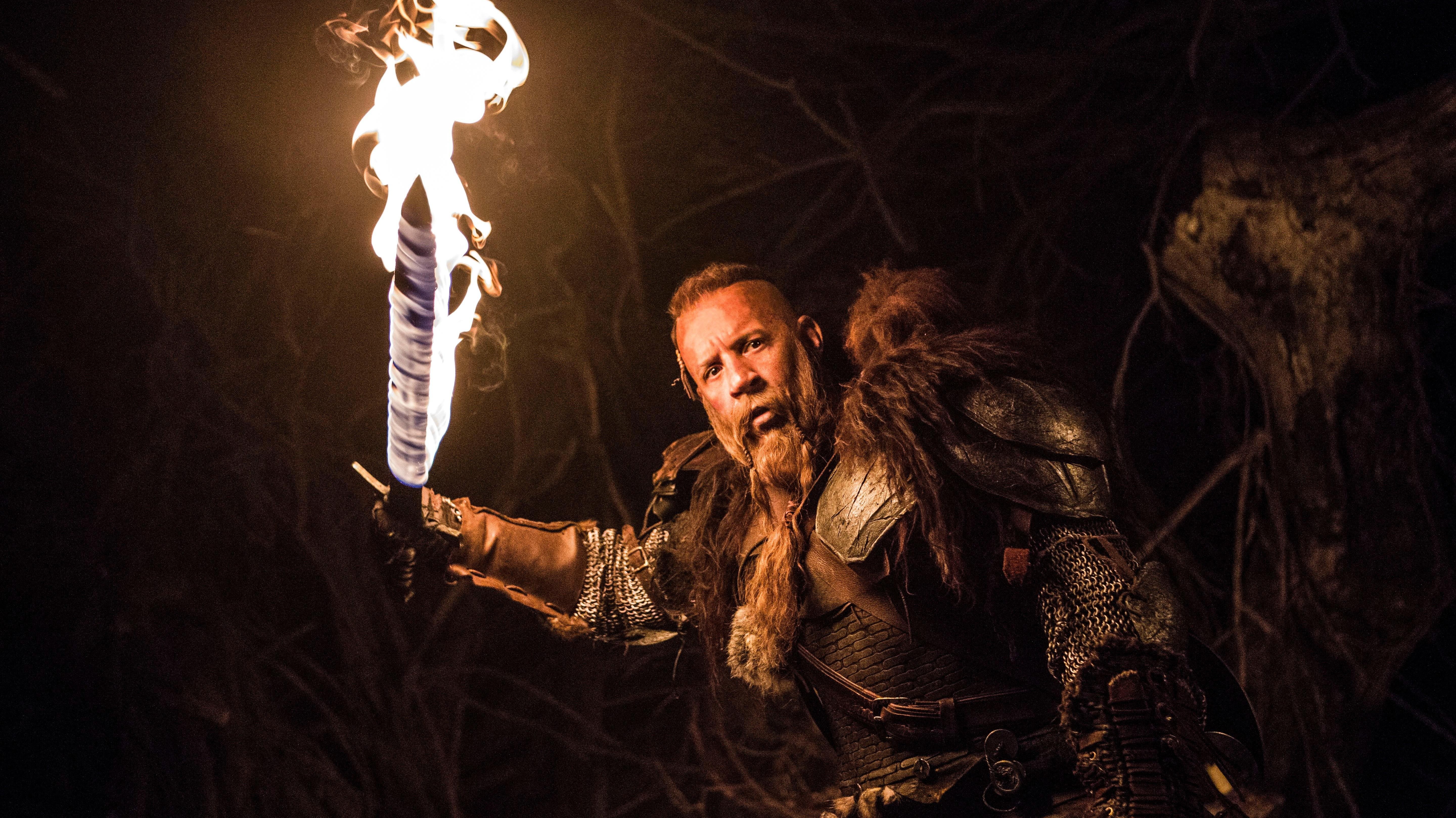 Kaulder (Vin Diesel) in medieval wear and wielding a flaming sword in a scene from "The Last Witch Hunter"