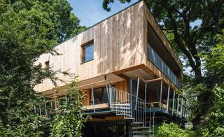 Treehouse self-build featuring cladding in timber house design