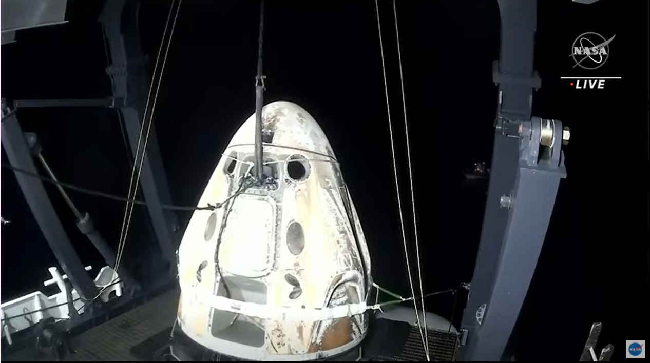 SpaceX's Crew-2 Dragon Endeavour is recovered by the recovery ship GO Navigator after a successful splashdown off the coast of Pensacola, Florida on Nov. 8, 2021.