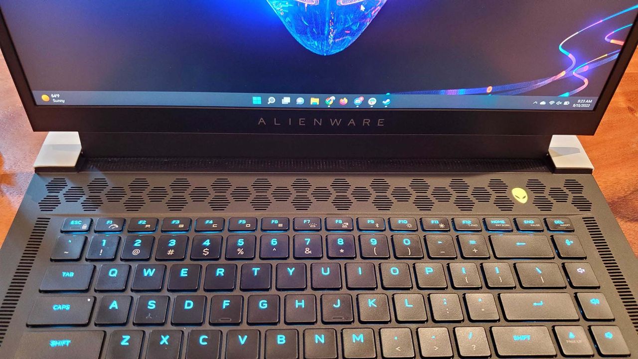 An Alienware x15 R2 gaming laptop on a wooden table