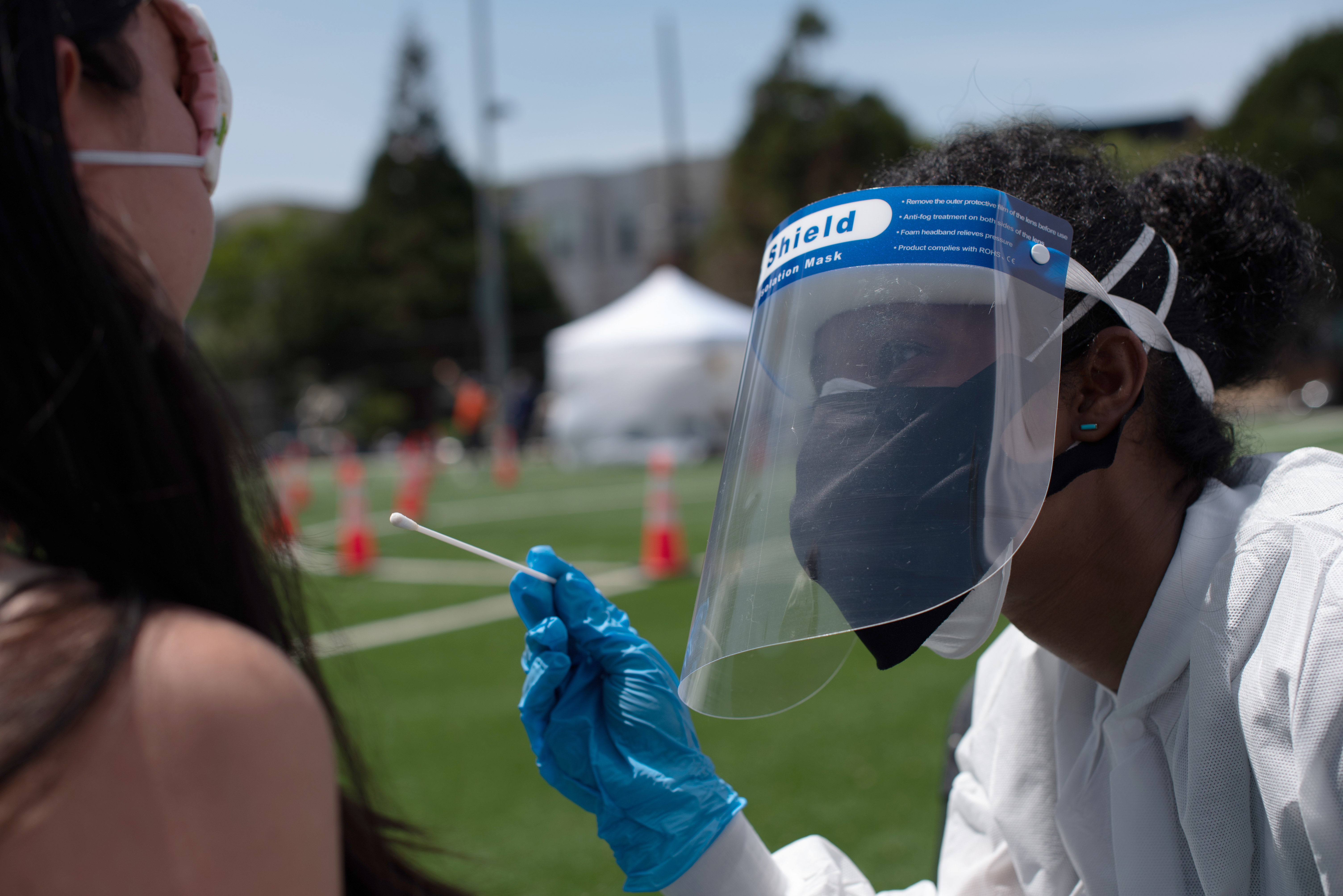 Collection of nasal swab samples for COVID-19 testing in Garfield Park, San Francisco.
