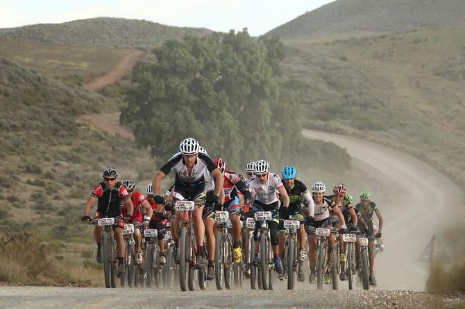 Bobby Behan of Fighting Boyz leads a group along the route during stage 3