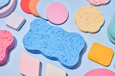 spring cleaning concept with sponges of different shapes and assorted colors