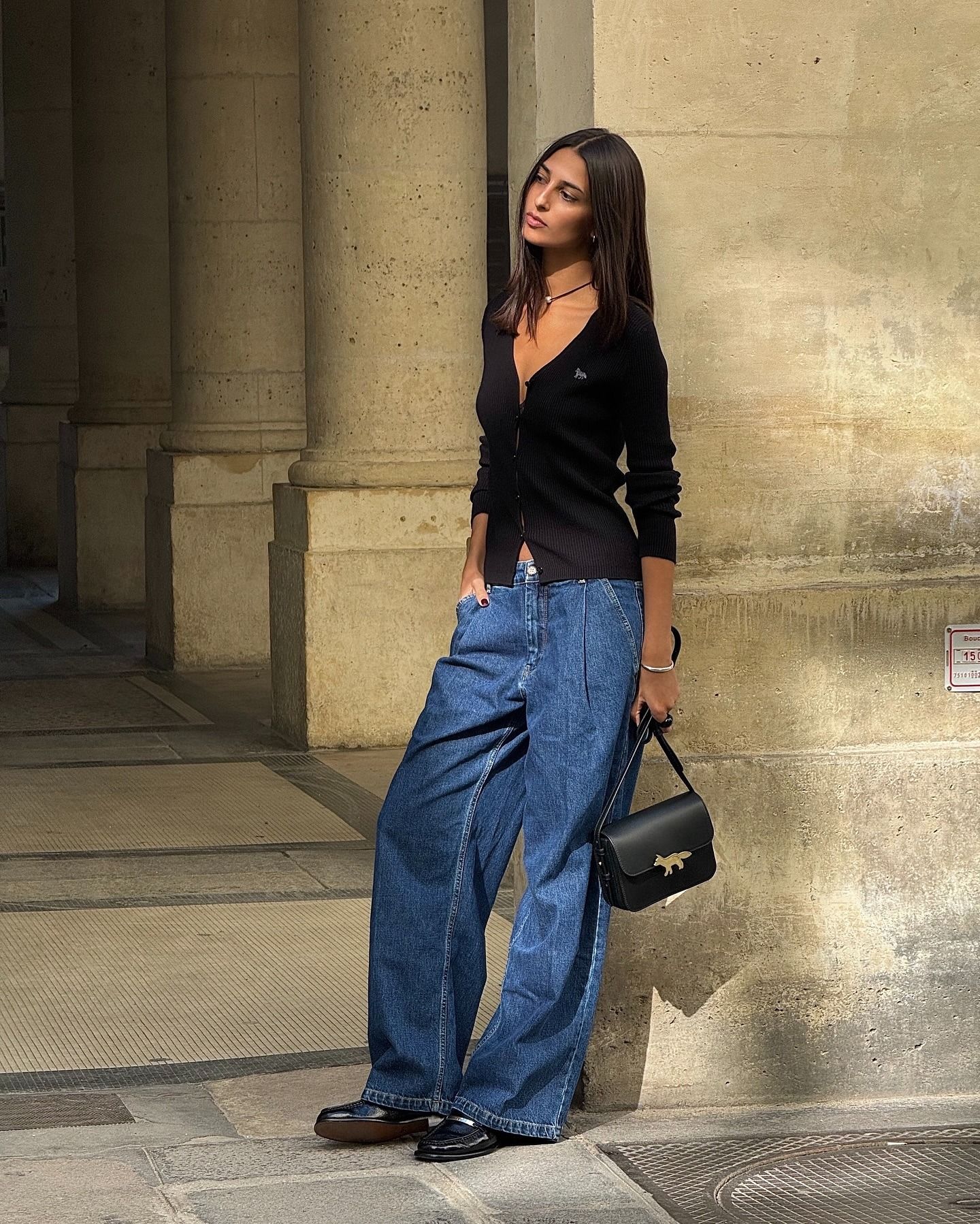 @salome.mory wearing jeans, a cardigan, and loafers