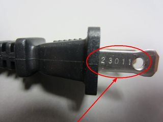 The plug prongs where the date code is found.