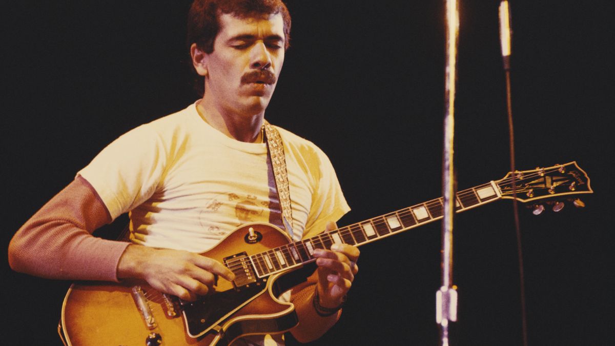 Carlos Santana performs live on stage with Santana in London on November 16, 1973. He is playing Gibson Les Paul Custom electric guitar.