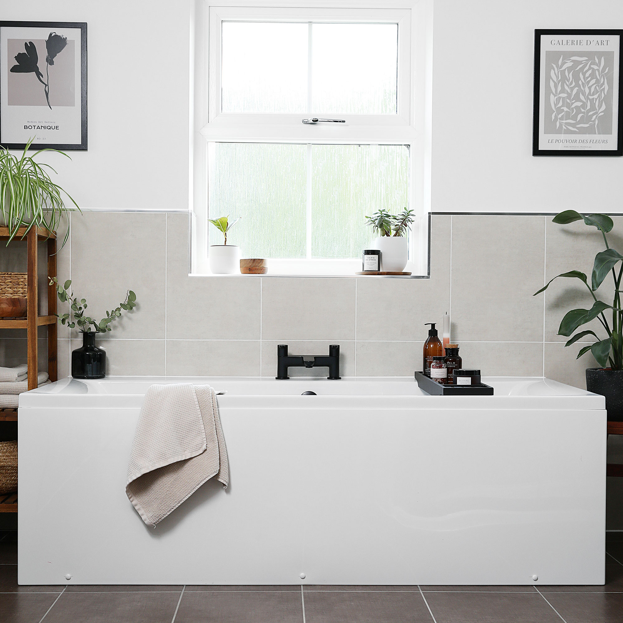 White and grey bathroom with a boxey fitted white bath tub