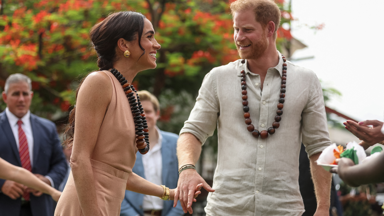 Britain&#039;s Prince Harry (R), Duke of Sussex, and Britain&#039;s Meghan (L), Duchess of Sussex, arrive at the Lightway Academy in Abuja on May 10, 2024 as they visit Nigeria as part of celebrations of Invictus Games anniversary