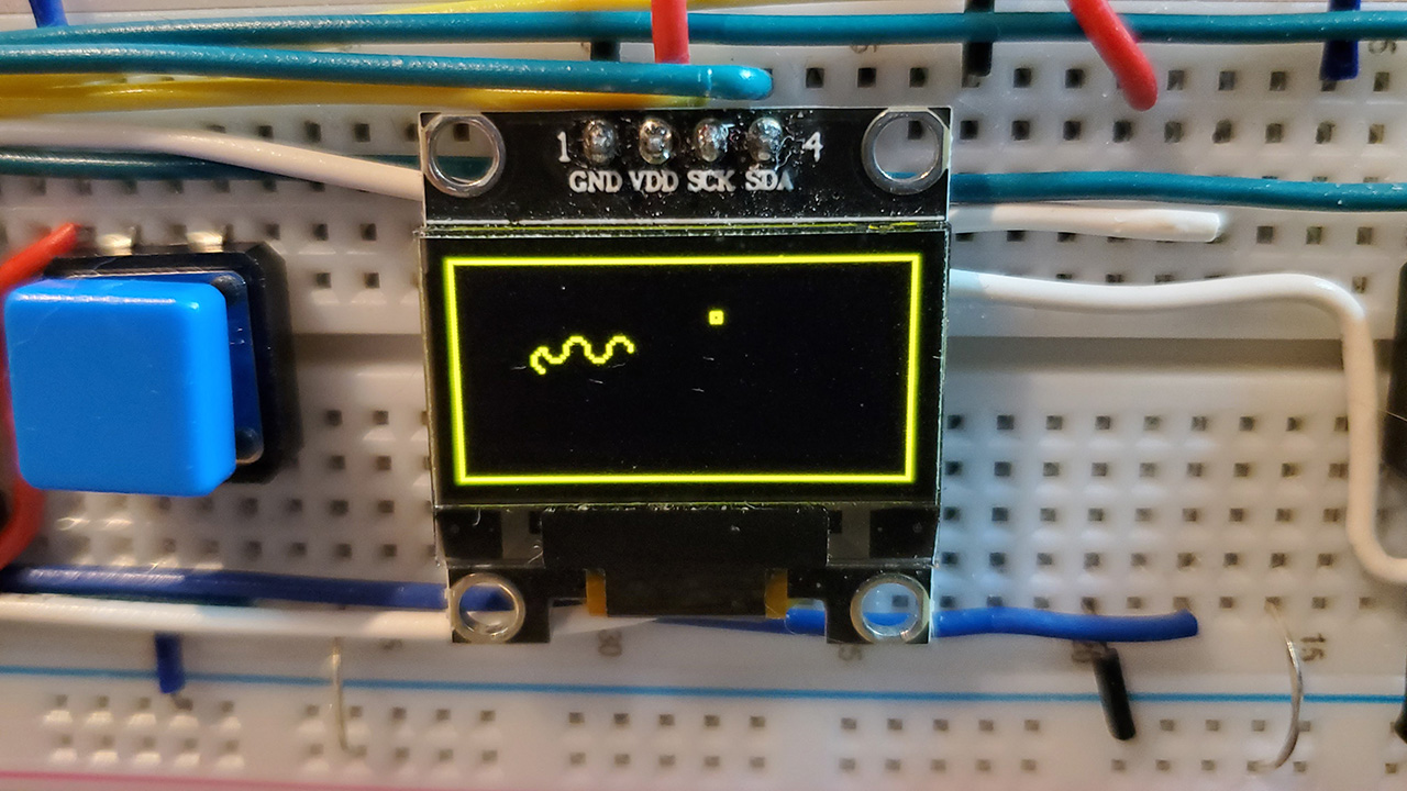 Snake playing on a tiny OLED screen