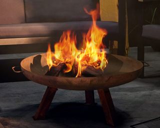 corten steel fire bowl with flames