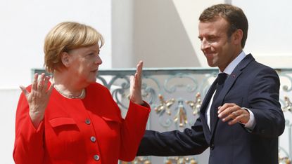 German chancellor Angela Merkel greets French president Emmanuel Macron 