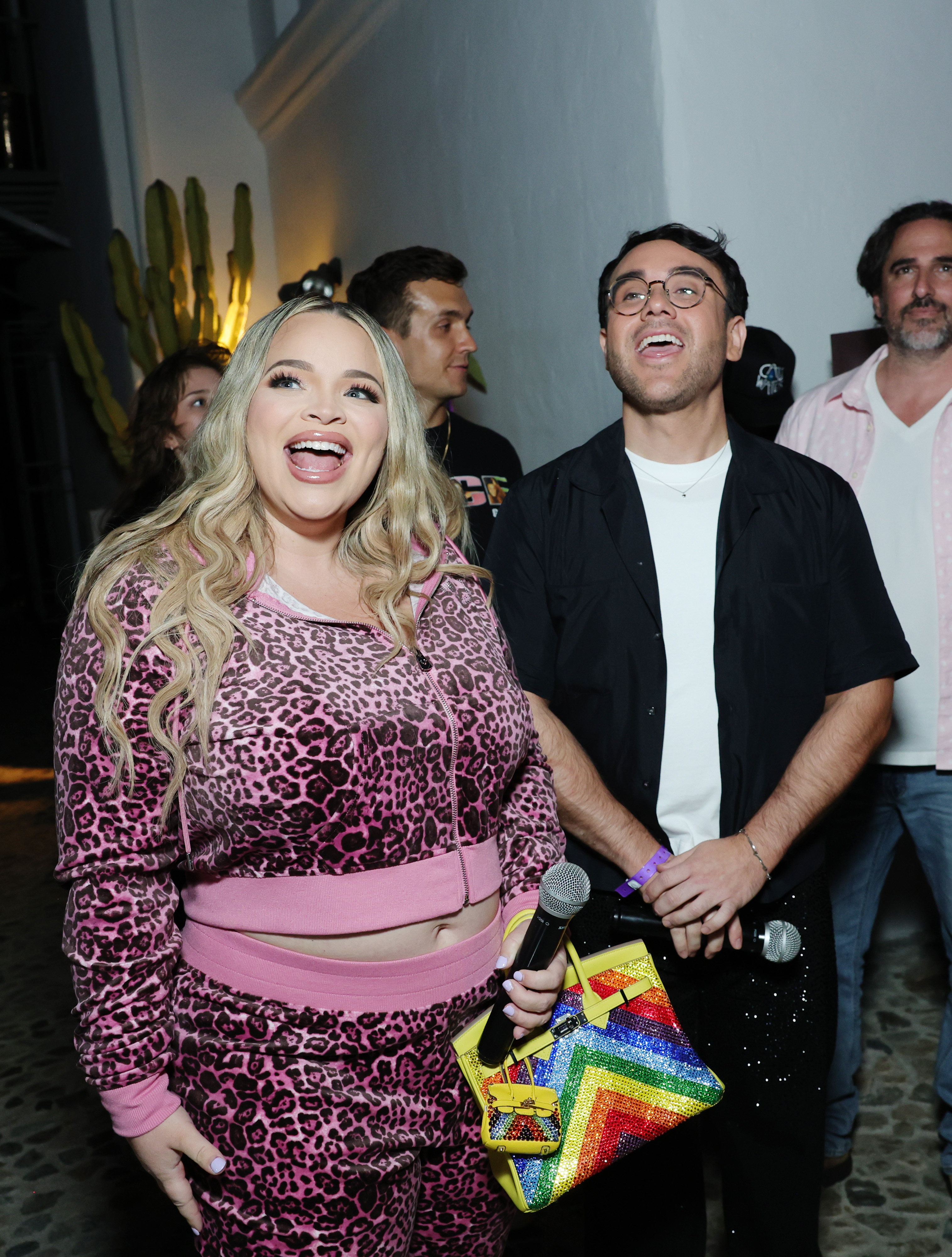 Trisha Paytas wearing a pink leopard-print velour tracksuit