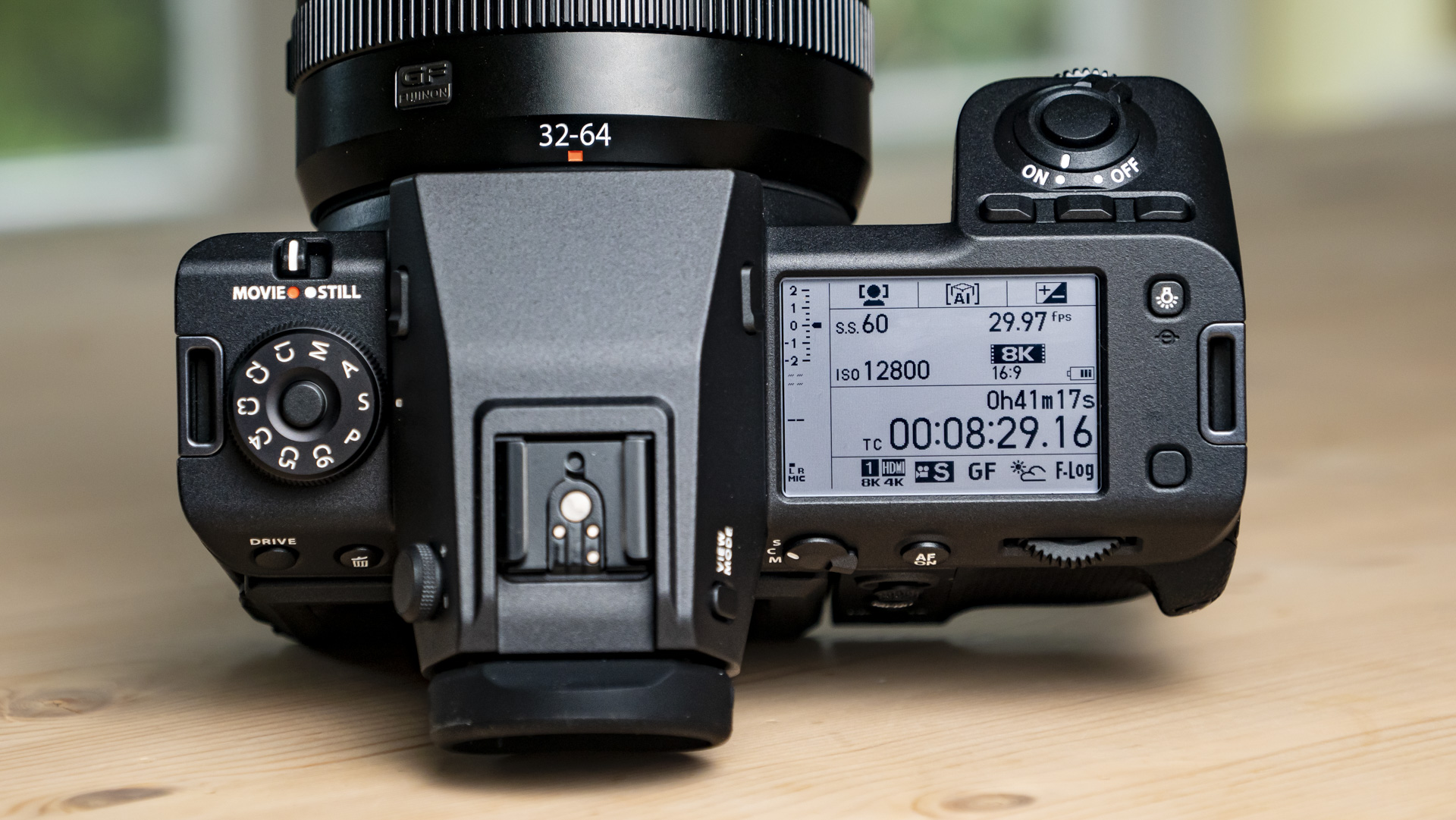 Top plate of the Fujifilm GFX100 II on a wooden table