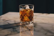 A glass of whisky on a table