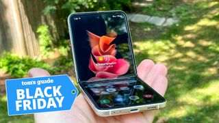 galaxy z flip 3 half folded in hand with black friday deal badge