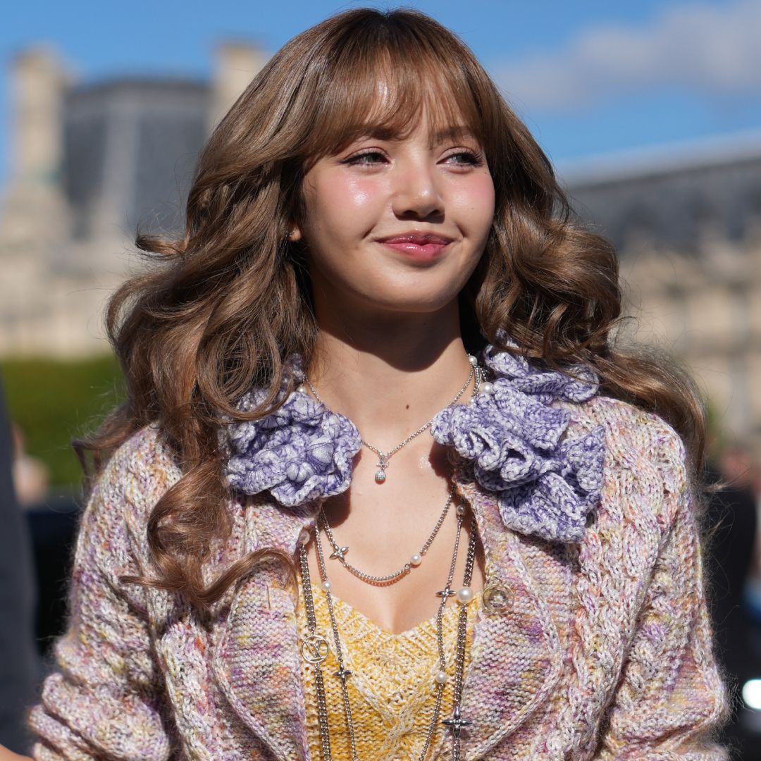 Lisa from Blackpink wore a knitted sweatsuit from Guest in Residence in the airport