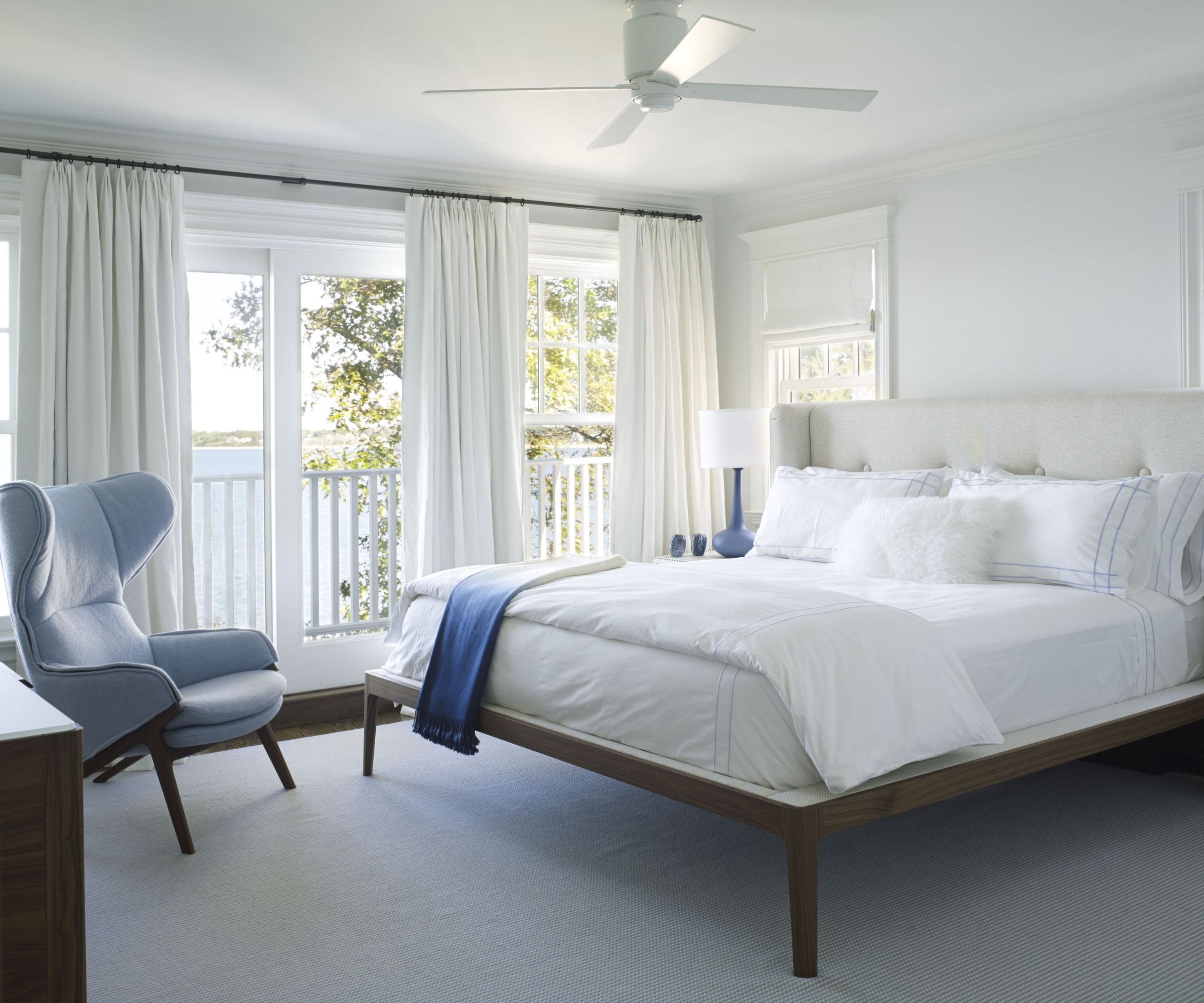 White bedroom with white bedding and white curtians