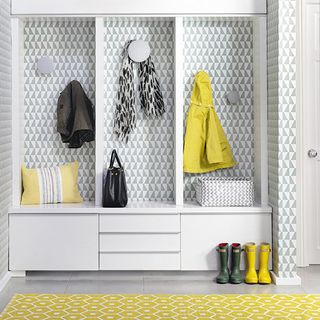 hallway storage with geometric yellow rug