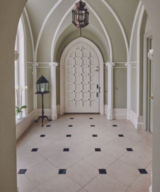 Gothic hall, arched front door, tiled flooring