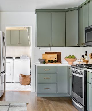 Green kitchen with laundry room
