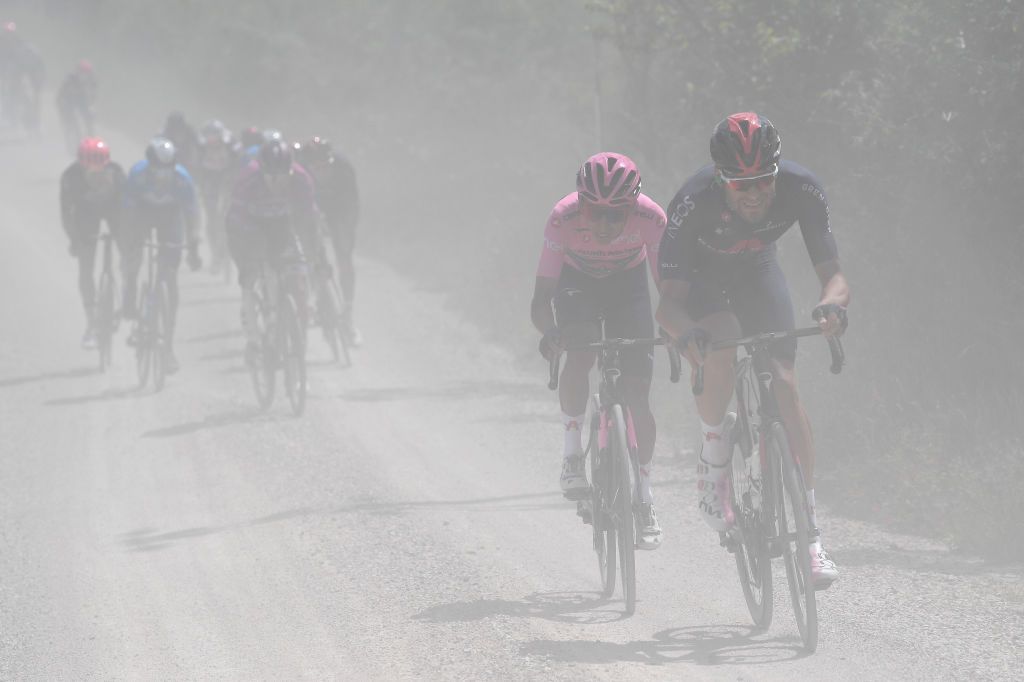MONTALCINO ITALY MAY 19 Filippo Ganna of Italy and Team INEOS Grenadiers Egan Arley Bernal Gomez of Colombia and Team INEOS Grenadiers Pink Leader Jersey during the 104th Giro dItalia 2021 Stage 12 a 162km stage from Perugia to Montalcino 554m Gravel Strokes Mud girodiitalia UCIworldtour Giro on May 19 2021 in Montalcino Italy Photo by Tim de WaeleGetty Images
