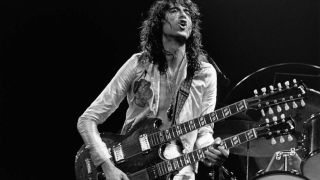 Jimmy Page with his double-necked guitar on stage