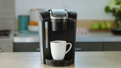 Keurig K-Select single-serve coffee maker on countertop in kitchen