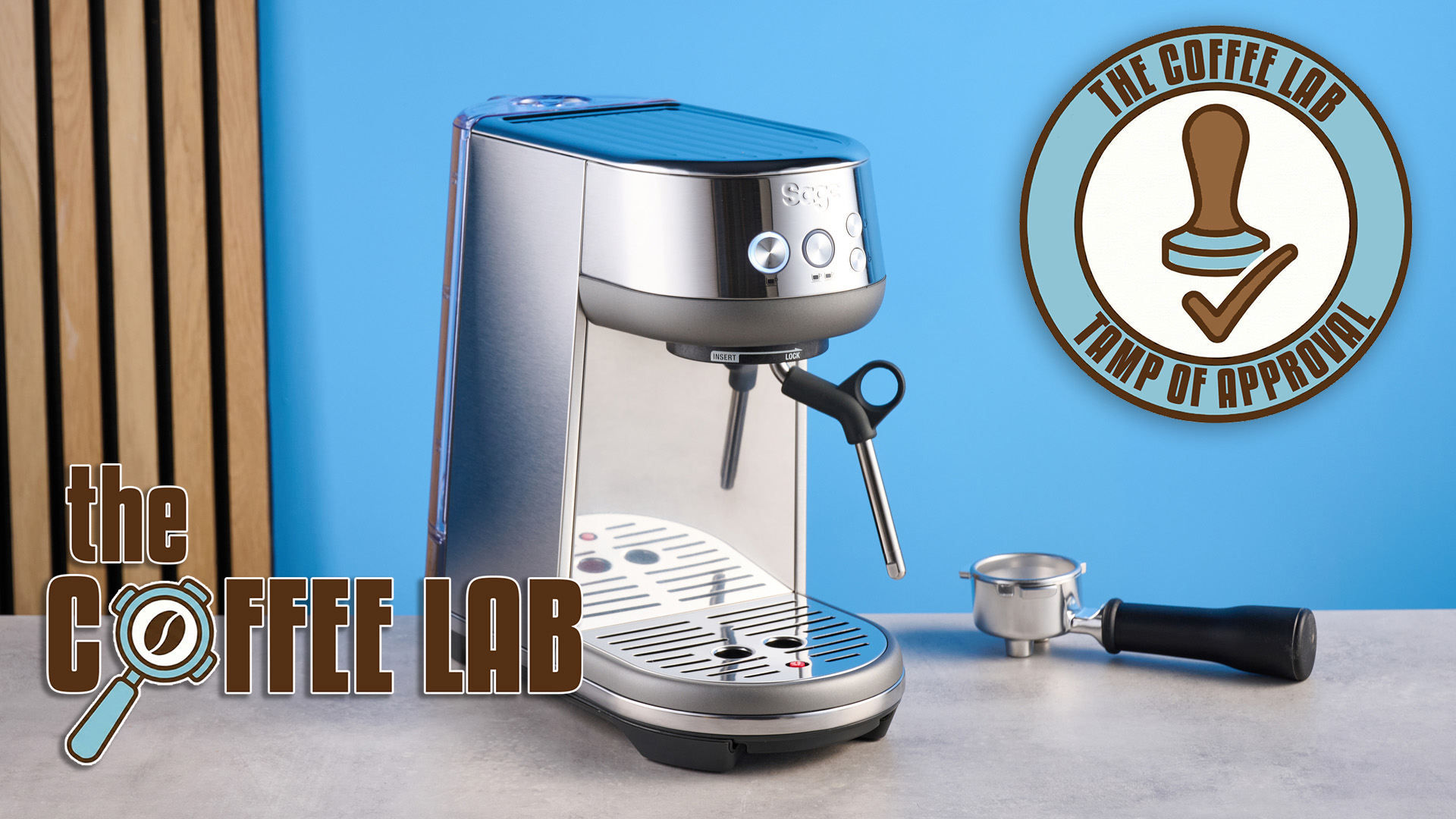 the breville bambino espresso machine on a blue tom's guide background with the coffee lab logo and the coffee lab tamp of approval sticker