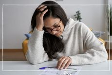 worried woman trying to understand her energy bill