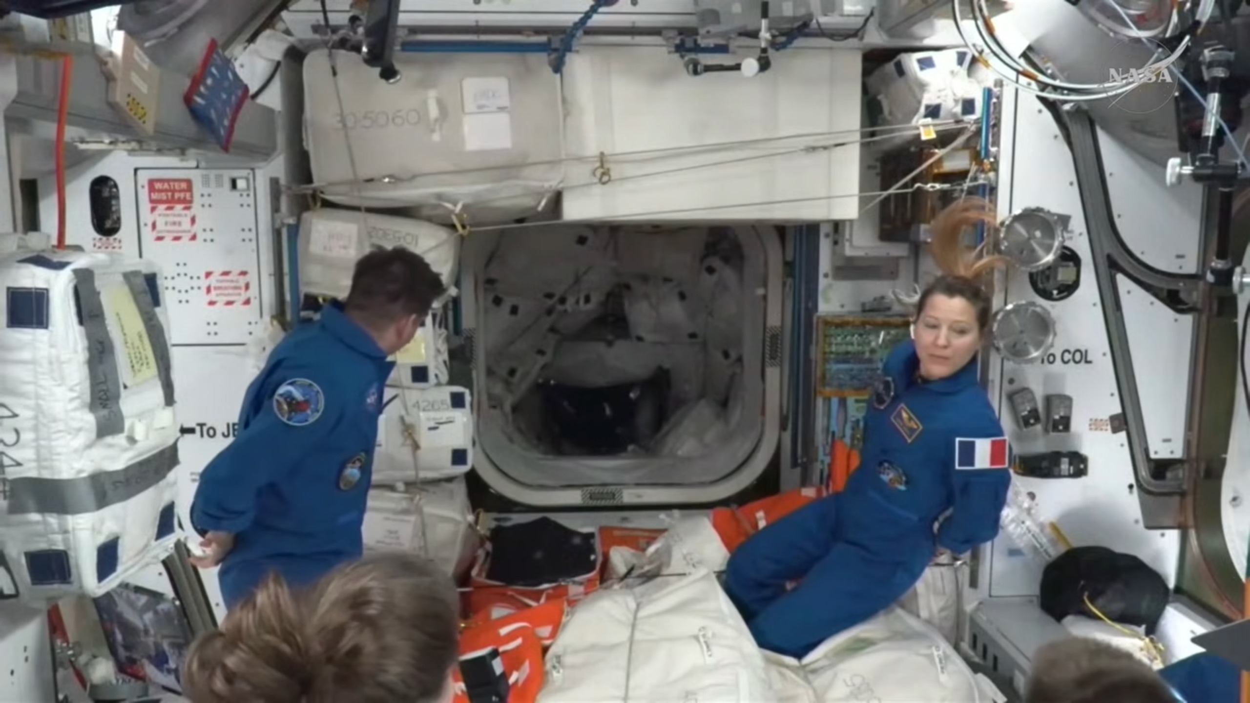 Astronauts aboard the International Space Station wait for the Crew-13 quartet to enter the orbiting lab on Oct. 1, 2026.