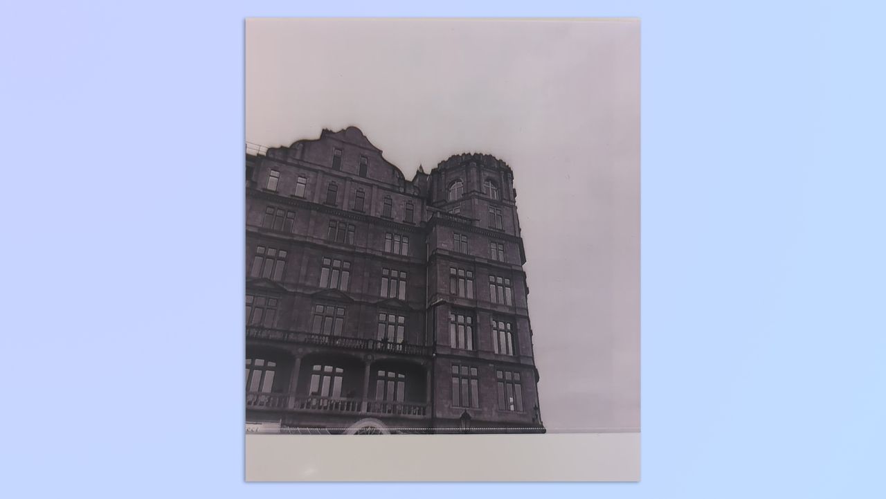A photo of an old building taken on a Kodak Mini Shot 4 Era 2-in-1 instant camera