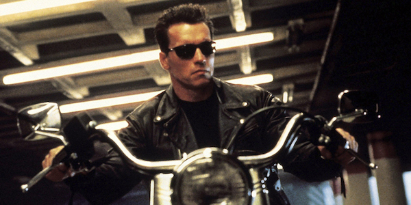 Arnold Schwarzenegger as the Terminator riding motorcycle