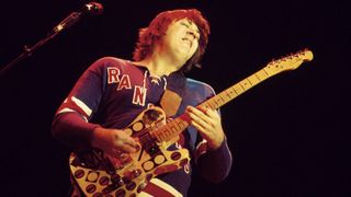Terry Kath performs onstage with his heavily customized 1966 Telecaster