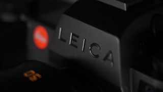 Leica SL3-S on a wooden surface with moody lighting