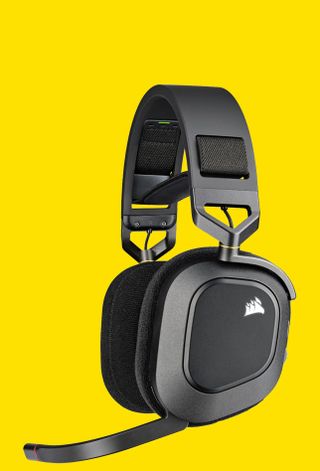 The Corsair HS80 RGB wireless gaming headset on yellow.