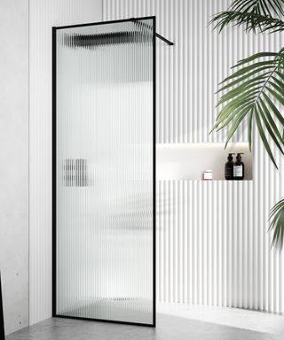 bathroom with white fluted tiles and opaque fluted tall shower screen with black frame