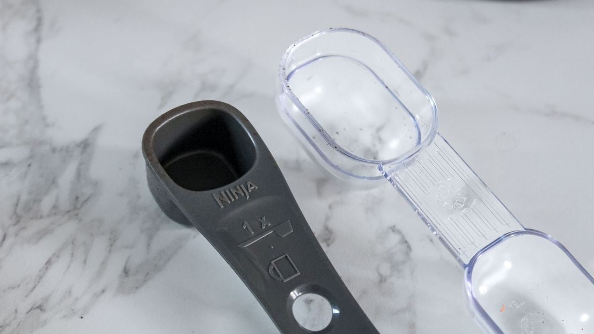 Mr. Coffee Perfect Brew Coffee Maker scoop next to a Ninja scoop