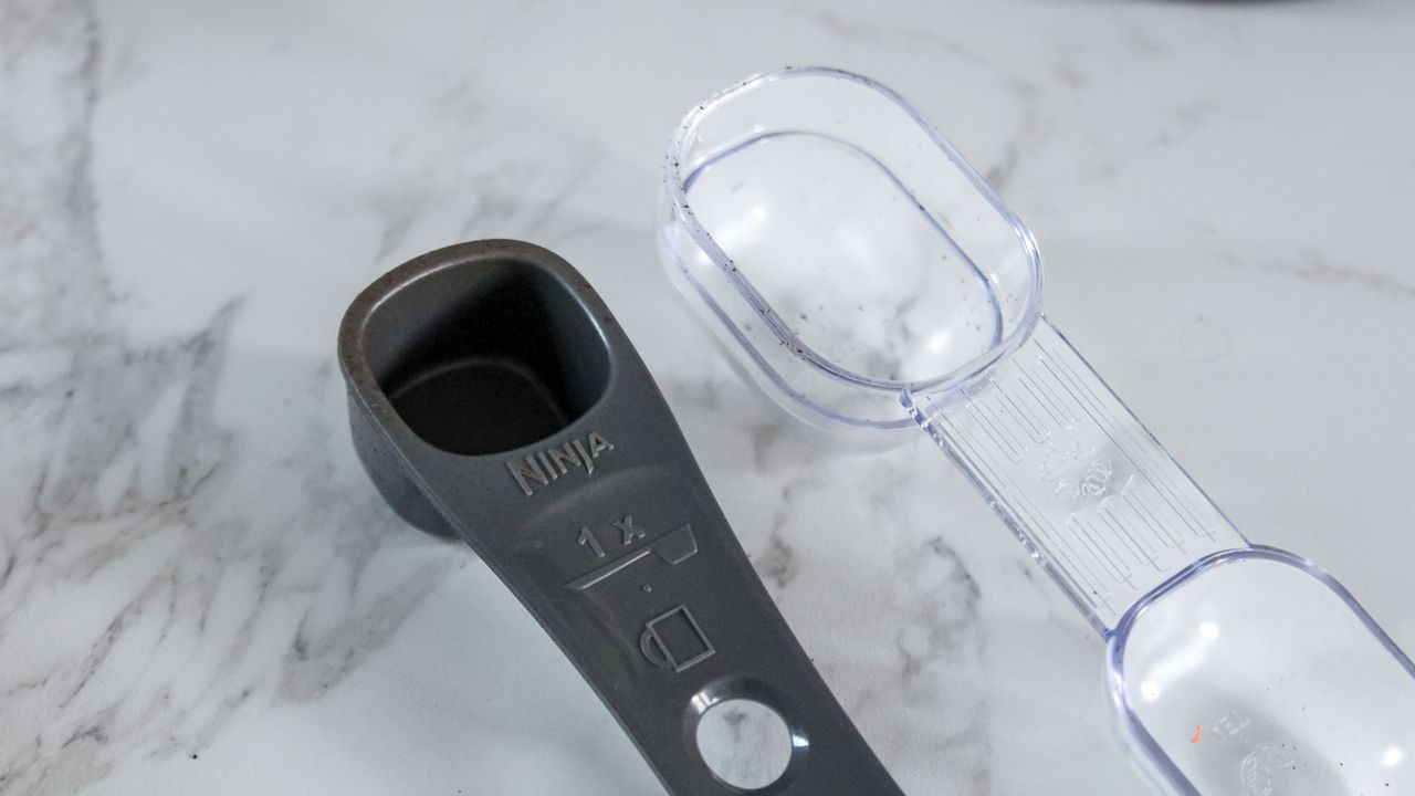 Mr. Coffee Perfect Brew Coffee Maker scoop next to a Ninja scoop
