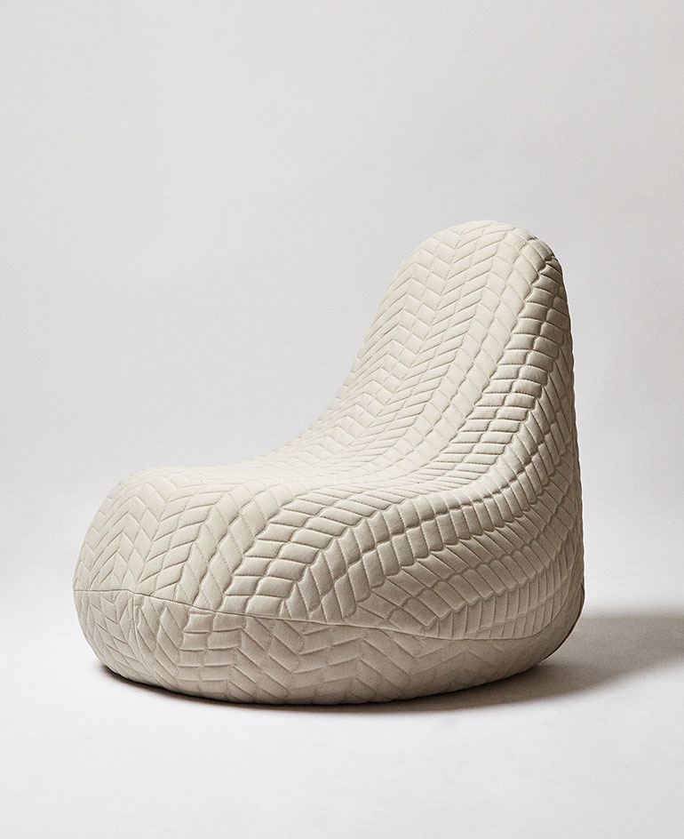 White quilted fabric sofa