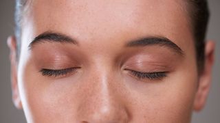 close up on woman's closed eyes