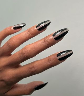 A negative space acrylic nail manicure by celebrity nail artist Queenie Nguyen