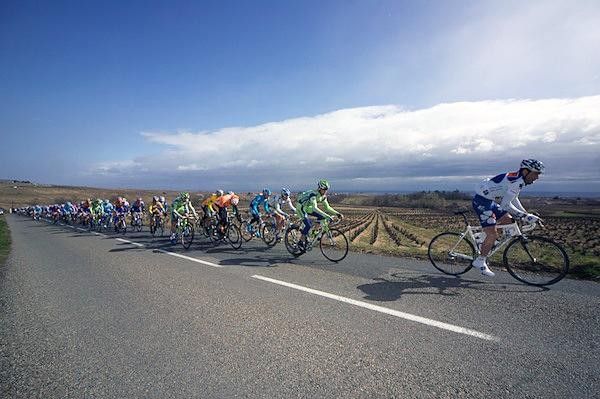 The peloton riding in the sun. Happy to leave the rain behind.