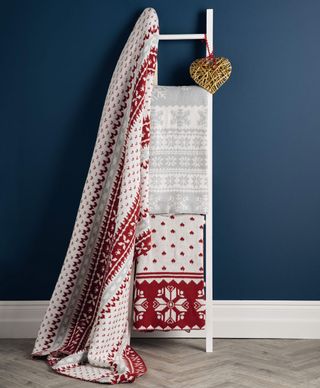 christmas nordic throws on white ladder and blue wall