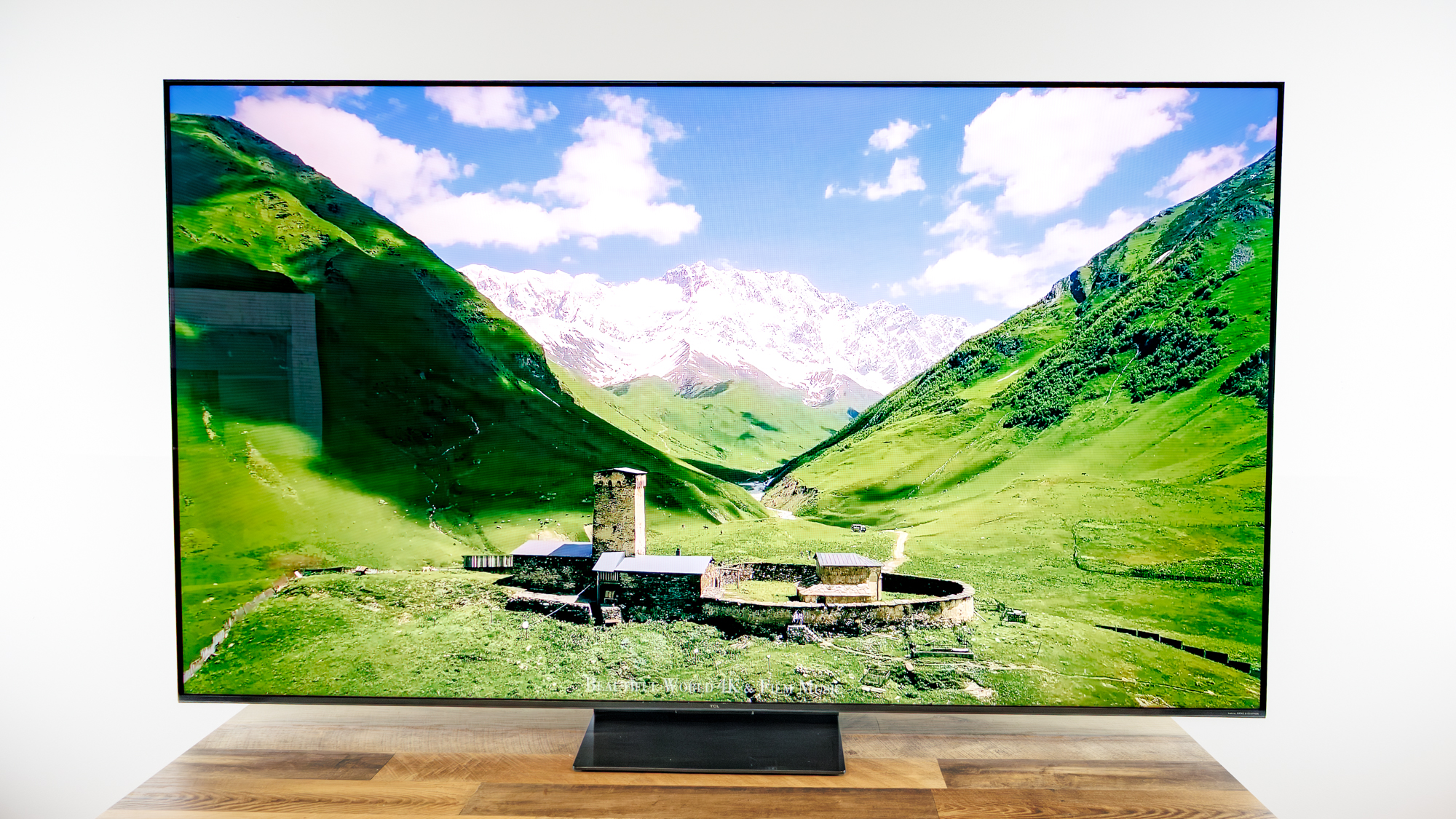 TCL QM7L 75-inch TV on a desk