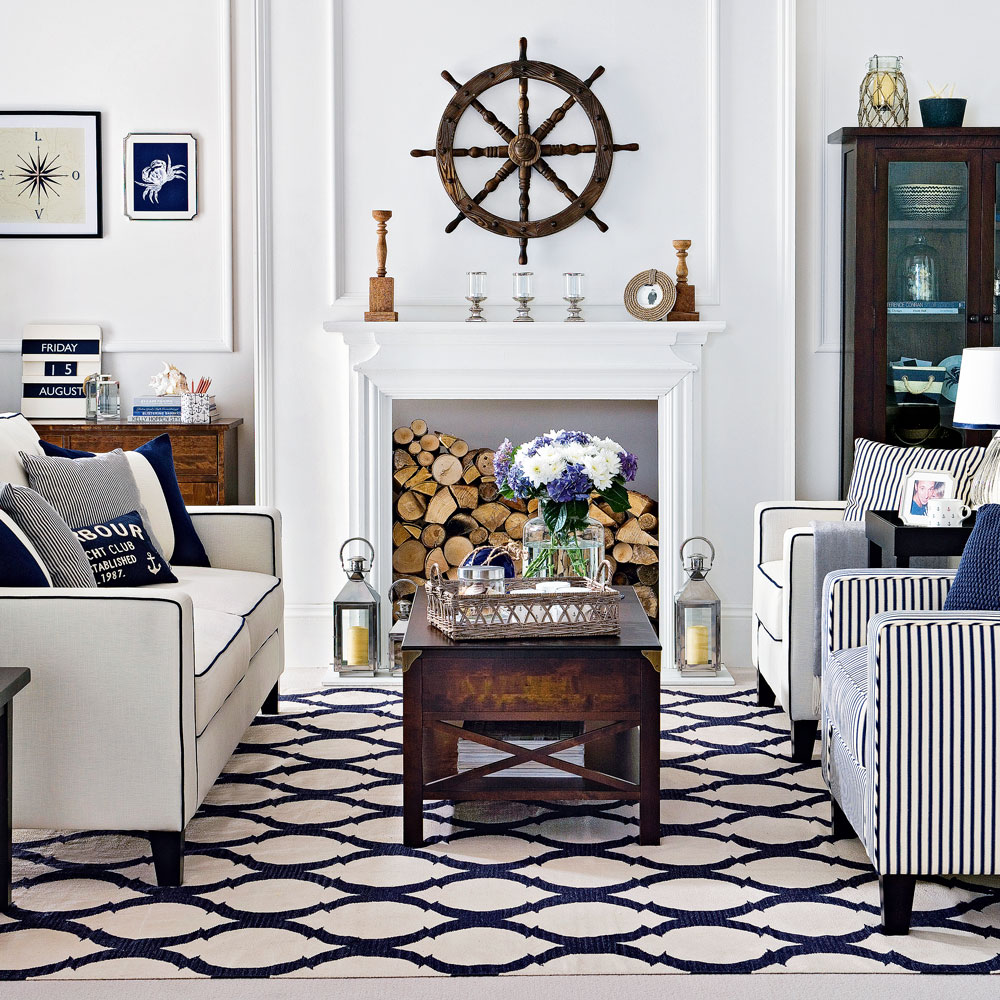 living room with white walls and black and white tiles with white sofa and cushions