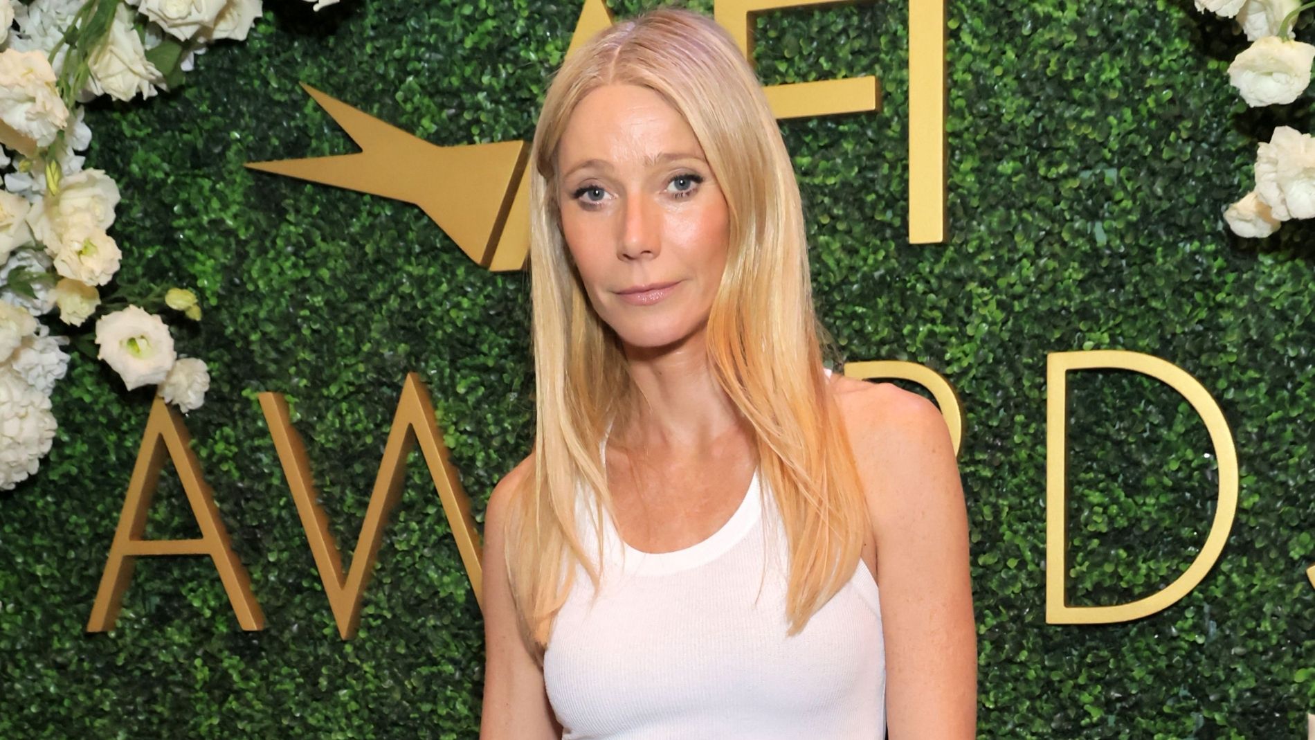 Gwyneth Paltrow wears a white tank top at the 2026 AFI Awards